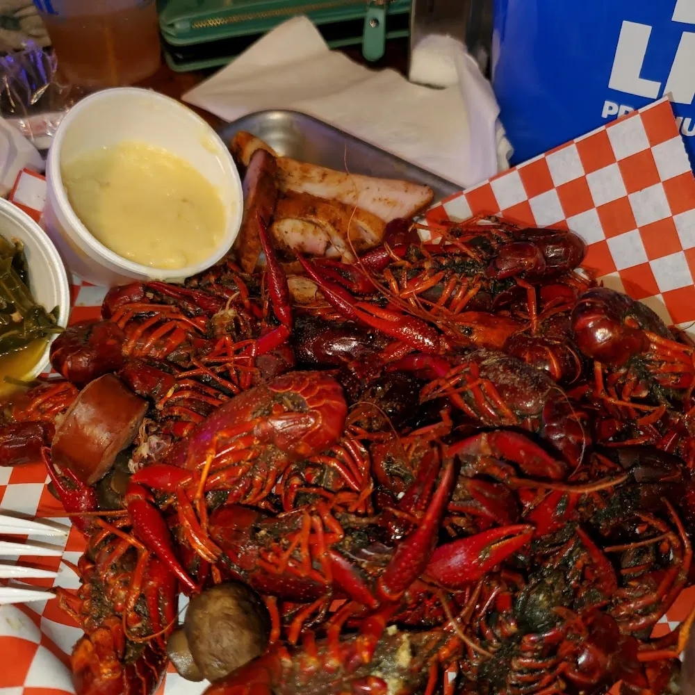 Crawdads Alligator Chese Grits Collard Greens
